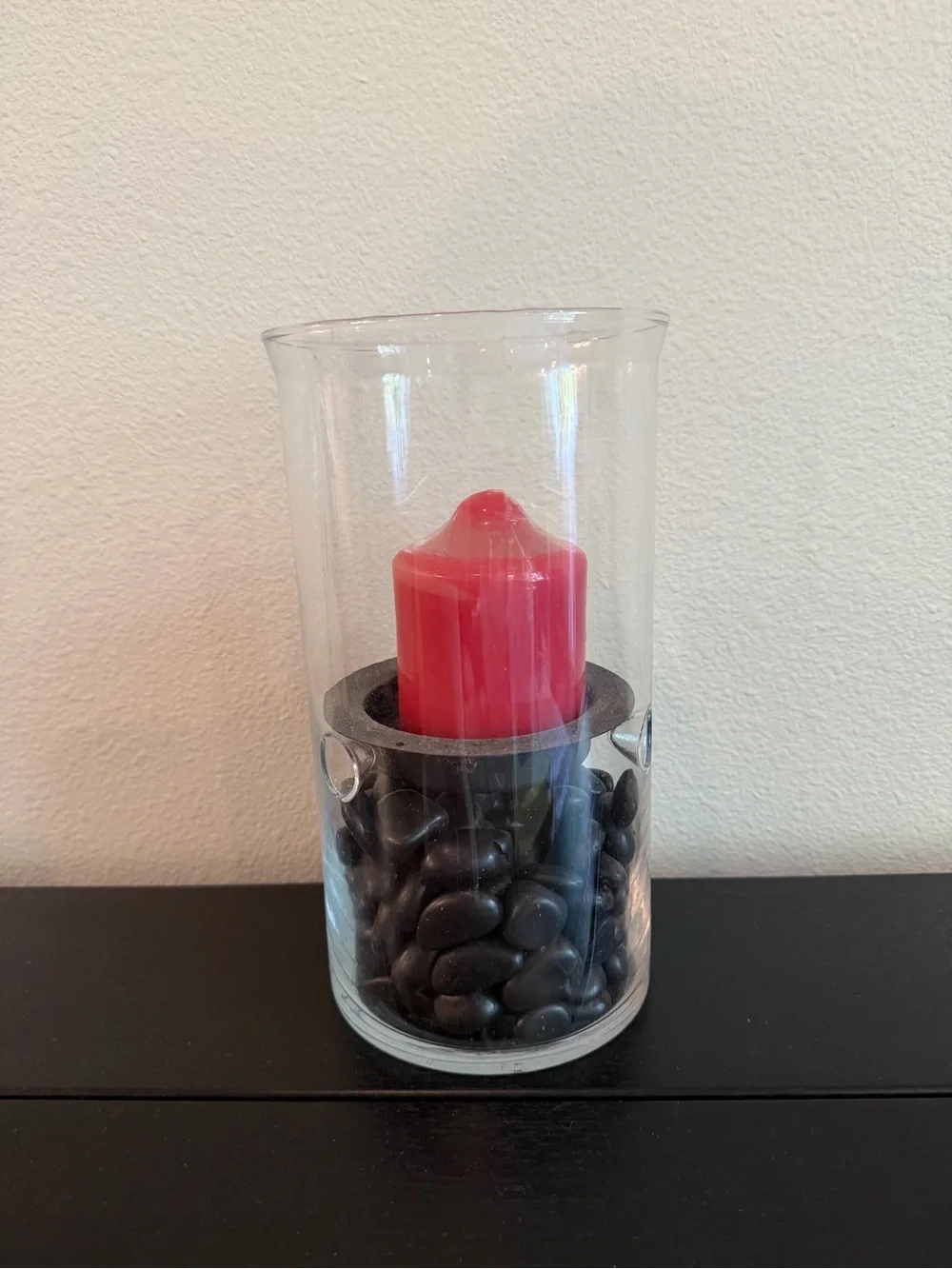 Glass Hurricane Candle Holder with Black Stones and Red Candle